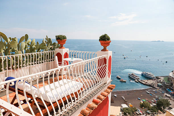 Scenic Terrace sun deck in Positano Amalfi Coast cliffside overlooking idyllic city view on sunny summer vacation day in italy
