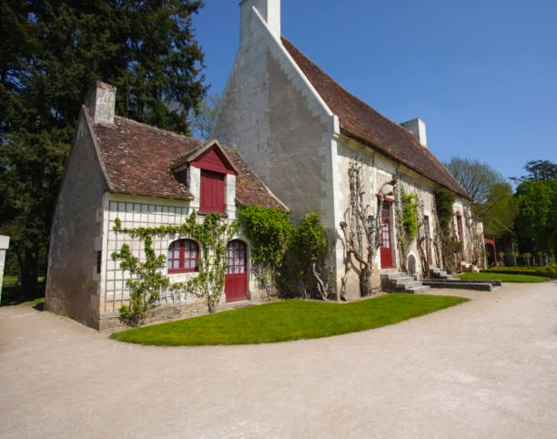 Chantmarle thatched cottage, near Cattistock, Dorset, England. Quaint and idyllic tranquil villages typify the Dorset landscape with stately homes, manor houses and traditional thatched cottages alongside the narrow roads