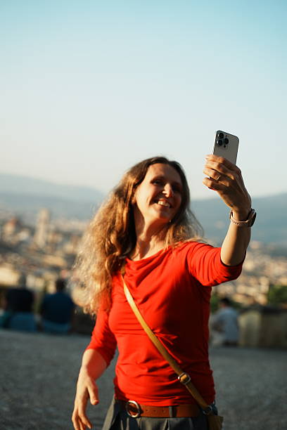 istock Young girl tourist takes a selfie 2201313380