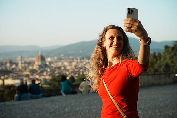 istock Young girl tourist takes a selfie 2201313385