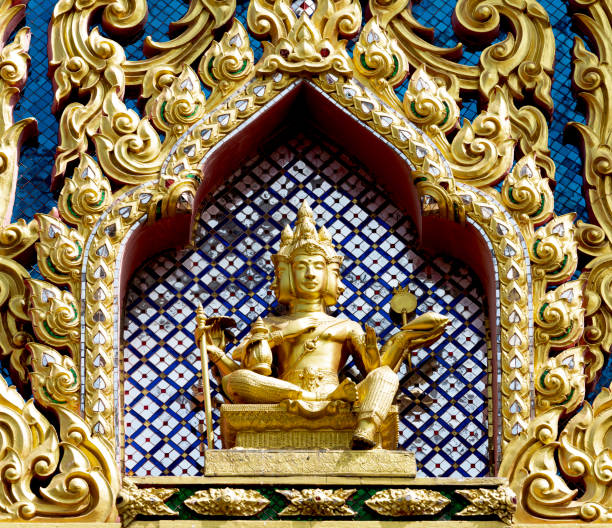 Shot in color detail on the facade of this historic building representing some character, animal or flower. Set at Bangkok, Thailand, Asia