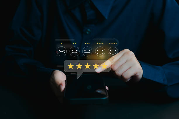 istock User Reviews and Feedback with Smiley Faces and Rating Stars, business concept 2201318640
