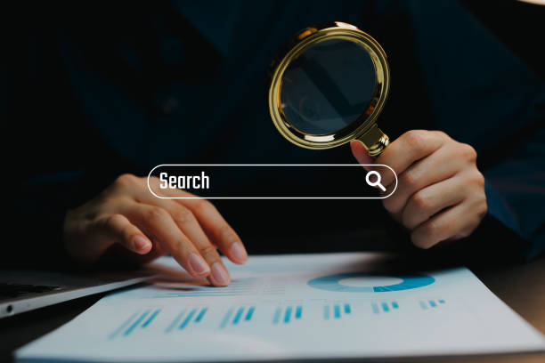 istock Detailed Examination of Data and Analytics with Magnifying Glass, business concept 2201318717