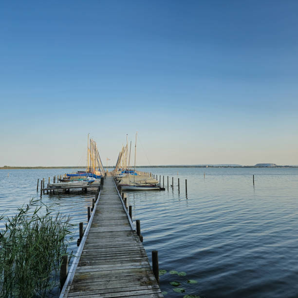 istock A Tranquil Pier at Sunset Over Calm Waters with a Beautiful Sky and Peaceful Surroundings Steinhuder Meer 2201326179