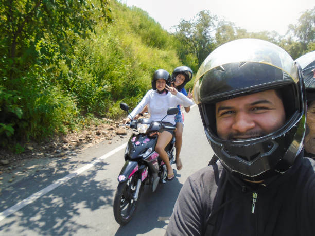 istock Selfie of three young Colombians riding a motorcycle 2201328261