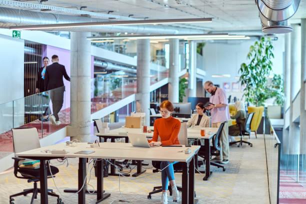 istock In a modern startup office, a diverse group of young professionals collaboratively tackles various business problems and challenges, surrounded by their engaged colleagues, fostering innovation and productivity 2201332067