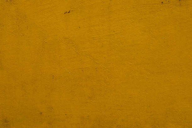 istock Vibrant yellow textured surface showcasing a unique artful appeal in a warm setting 2201333352