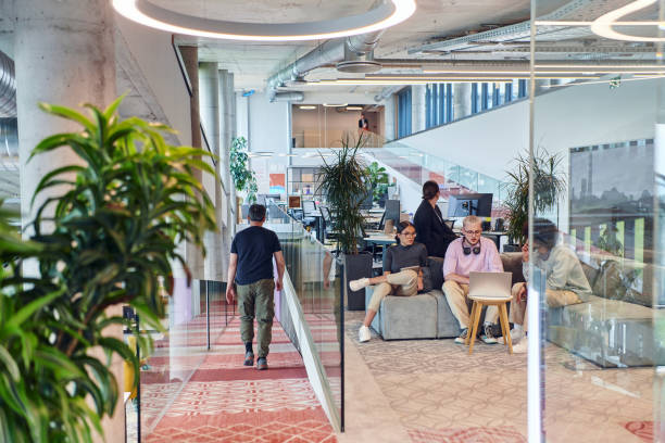 istock In a modern startup office, a diverse group of young professionals collaboratively tackles various business problems and challenges, surrounded by their engaged colleagues, fostering innovation and productivity 2201333772