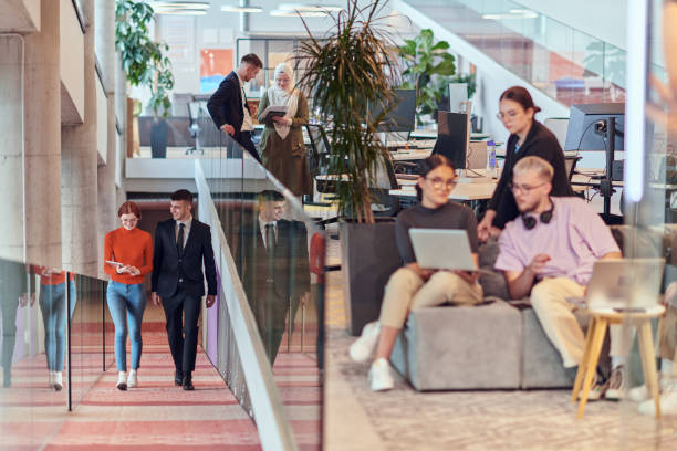 istock In a modern startup office, a diverse group of young professionals collaboratively tackles various business problems and challenges, surrounded by their engaged colleagues, fostering innovation and productivity 2201333880