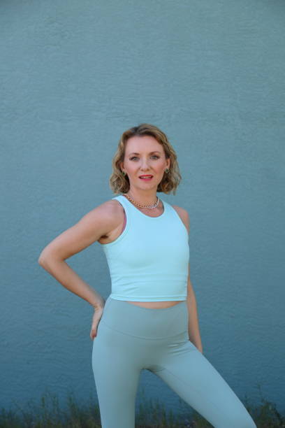 istock Woman in sport outfit on front different backgrounds 2201335903