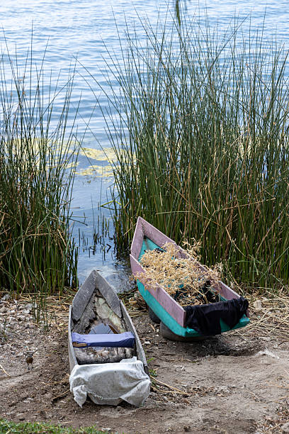 Traditional dug out canoes at peaceful, calm Lake Atitlan at Santa Catarina, Palopo, Guatemala.   Full frame, no people. Part of a series.