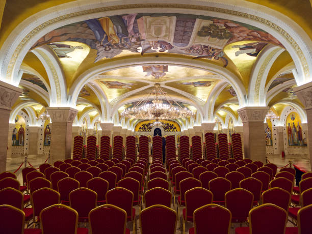 istock Ornate Auditorium with Arched Ceilings and Chandeliers 2201350034