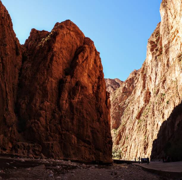 istock Scenic mountain gorge with steep rocky cliffs under a clear blue sky in Todra Gorge, Morocco 2201354071