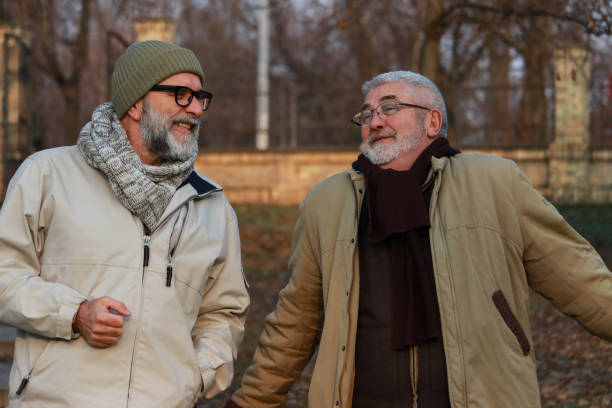 istock Conversation of two old men on the street 2201354427