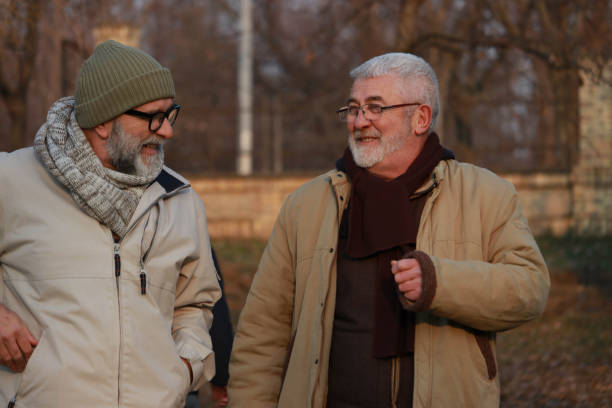 istock Conversation of two old men on the street 2201354439