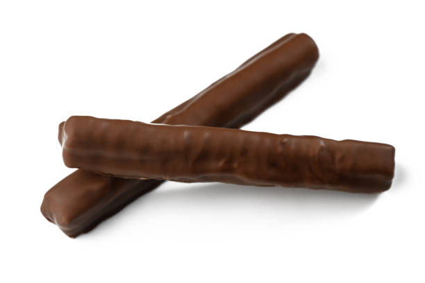 istock Delightful chocolate bars stacked on a white surface, ready to be enjoyed during a snack break 2201356460