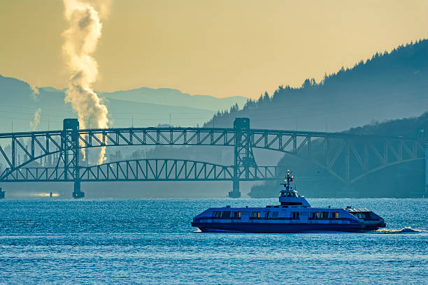 View of a harbor ferry crossing the Burrard Inlet in Vancouver, British Columbia