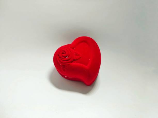 red heart shaped ring box with floral motif isolated on white background isolated