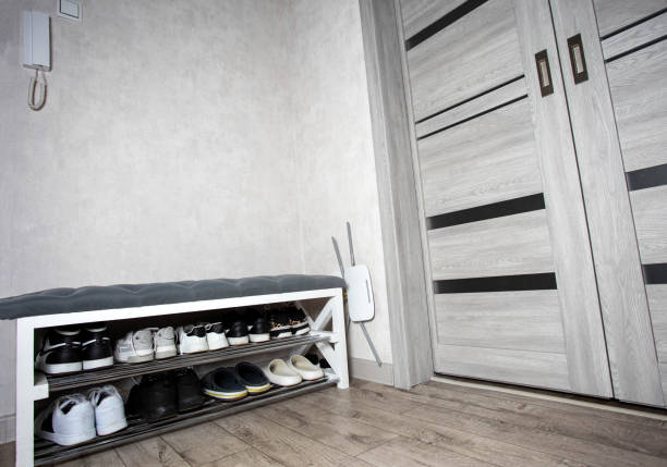 istock Modern stylish shoe rack in the hallway, stylish interior. Copy space for text, design 2201386496