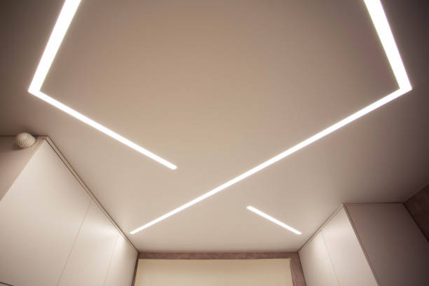 istock Modern designer stretch ceiling with illuminated LED lines in the room, backlighting 2201386586