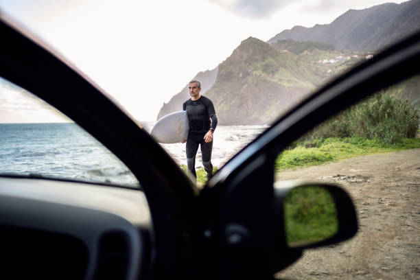 istock Surfer Comes Back From Surfing To His Car 2201387743