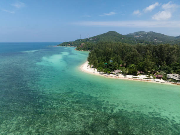 istock Secluded beach with forest backdrop and turquoise waters. Ko Pha Ngan, Thailand. 2201393087
