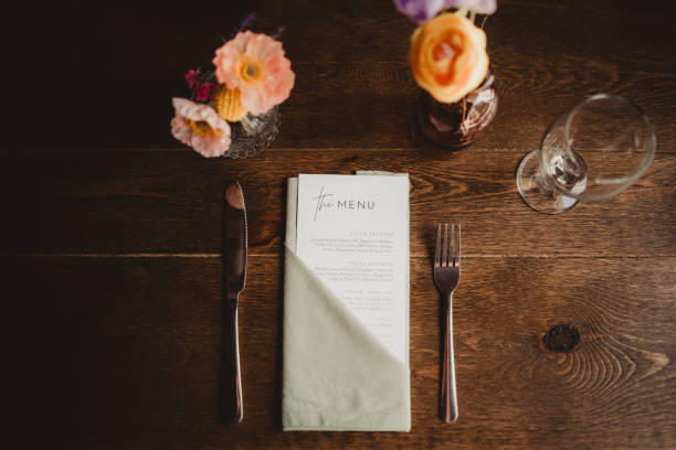 istock Top down photo of menu and flowers table setting 2201398665