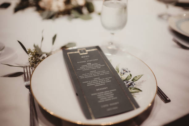 istock Close up of table setting with menu on vintage plate 2201402390