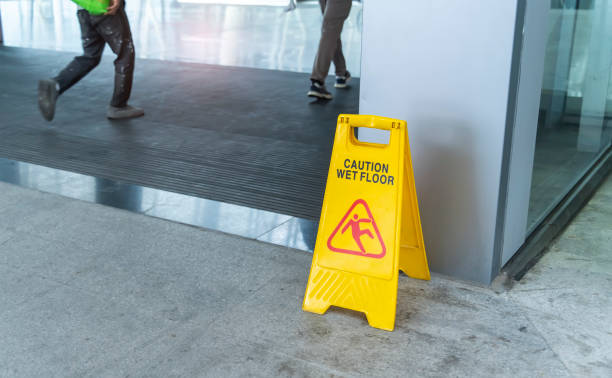istock Caution wet floor sign on wet floor 2201402452