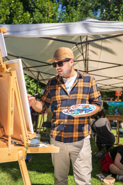 istock An Artist Painting in a Beautiful, Bright, Sunny Environment While Engaging with Nature 2201403527
