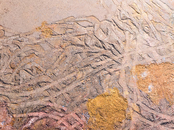 istock Wheel tracks on the ground on the dirt road. 2201405473