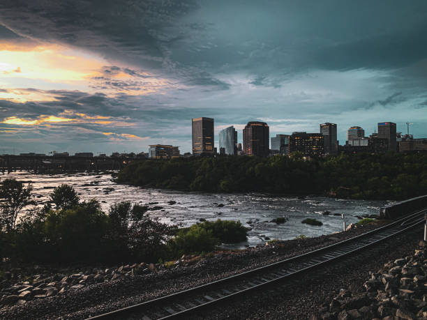 istock City skyline with river and train tracks 2201411628
