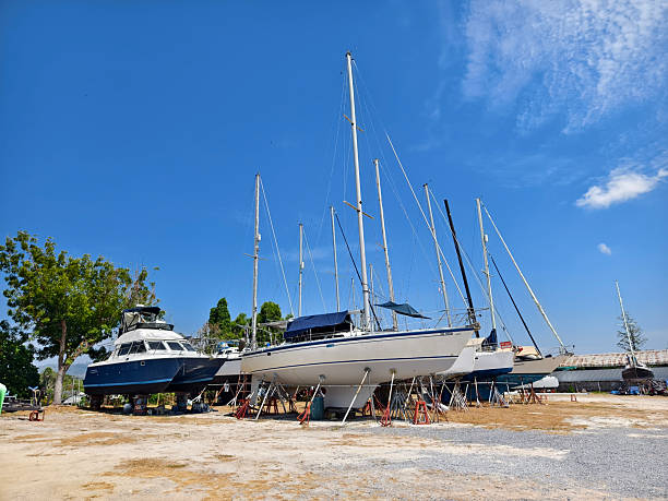 istock A white voyage boat featuring a steering wheel floating in the dock 2201413343