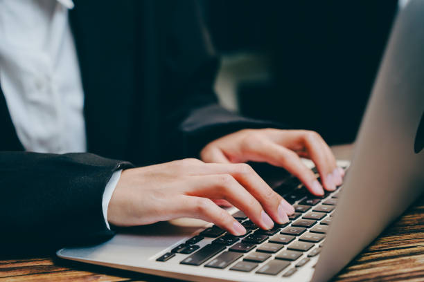 istock Business Professional Typing on Laptop at Modern Workspace Desk, business concept 2201413444