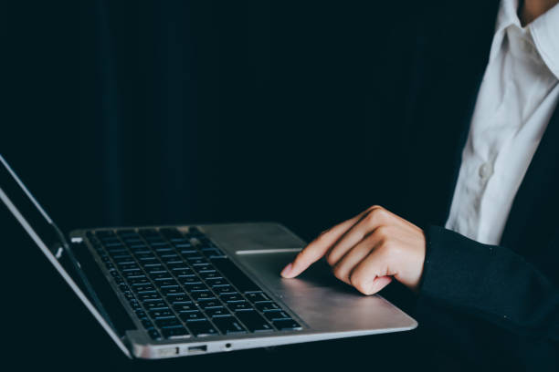 istock Business Professional Using Laptop in Dark Environment for Work, business concept 2201413476
