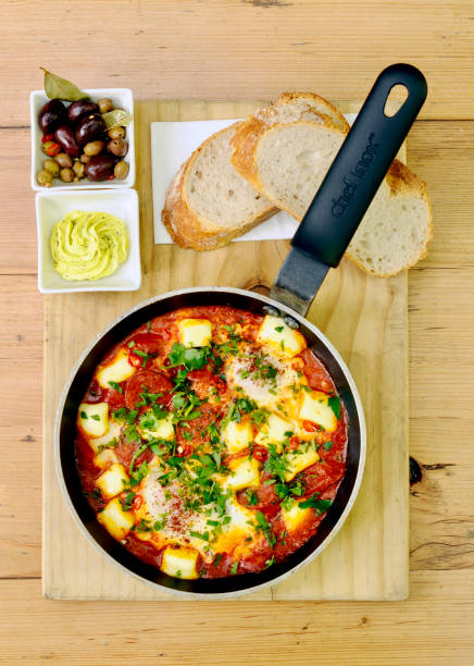 istock Shakshuka, Egg Breakfast in a Pan with bread and Olives 2201418182