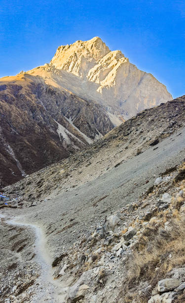 istock Mountain peak Yakwakang illuminated by the sun. 2201422988