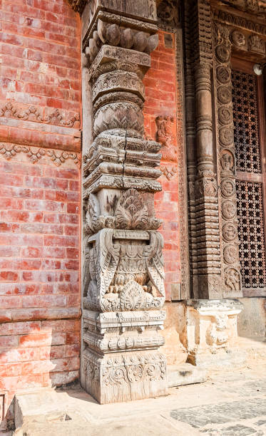 istock Carving on a wooden column near the wall. 2201423159