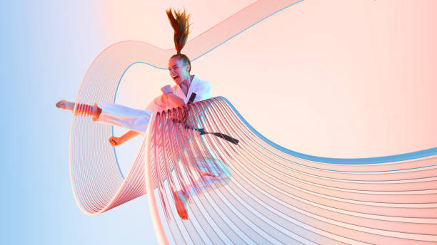 istock Modern collage. Martial artist executing high kick with intense expression as motion lines curve around body against vibrant background. 2201424343