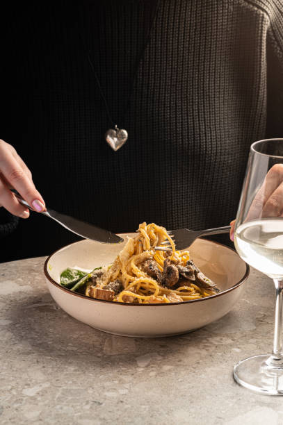 istock Creamy Mushroom Pasta with Parmesan and Fresh Greens 2201426490