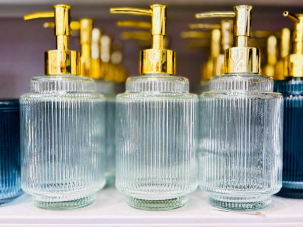 istock Glass Soap Dispensers with Gold Pumps 2201432000