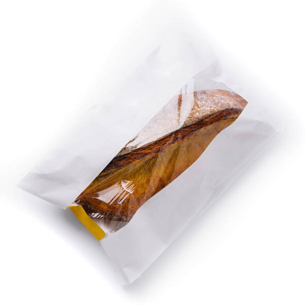 istock Fresh baguette in paper bag isolated on white 2201436329