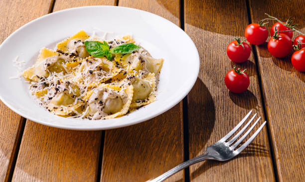 istock Gourmet italian ravioli on rustic wooden table 2201436354