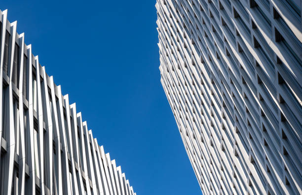 istock Low angle view of modern office buildings against clear sky 2201441634