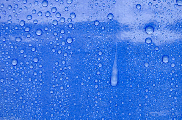 istock Rain water droplets with dark ocean blue color background suitable for wallpaper. 2201441849