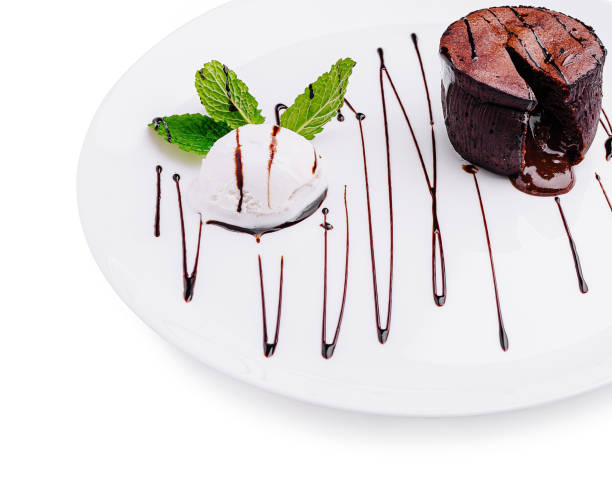 istock Delicious chocolate dessert with mint and ice cream served elegantly on a white plate 2201442880
