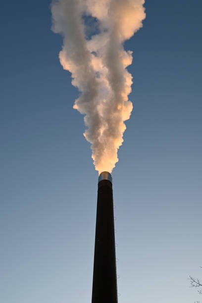 istock Steaming Smokestack in Hamburg 2201444789