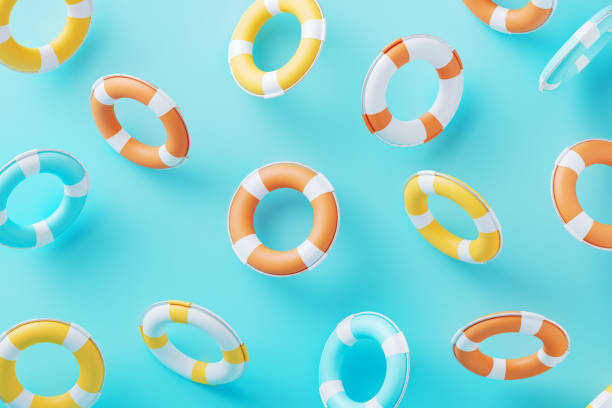 istock Colorful Life Buoys On Blue  Background 2201450336