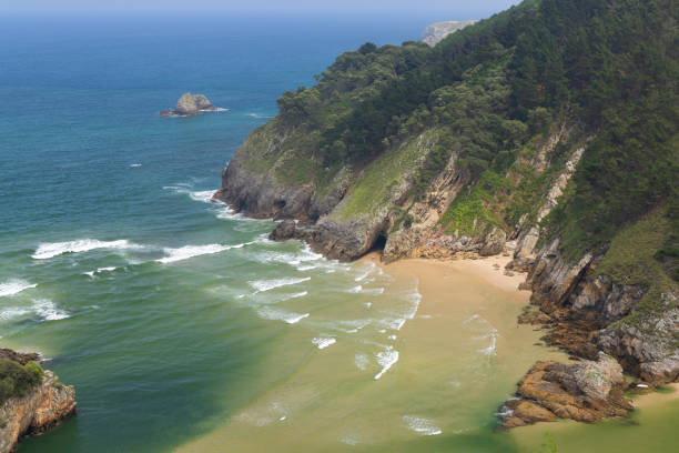 Typical landscape with Playa del Sable near Pesues, Cantabria, Spain