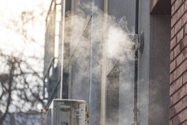 Steam exhaust pipe of a gas heater of a residential building during the winter. A way of sustainable way of air conditioning.
